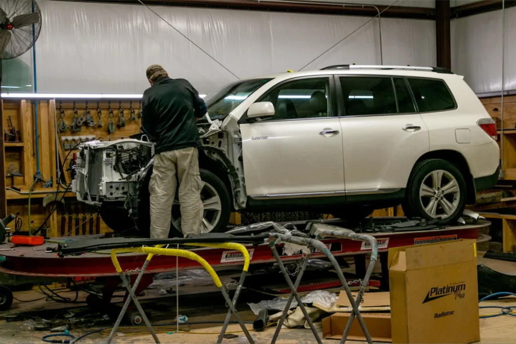 collision repair tech working