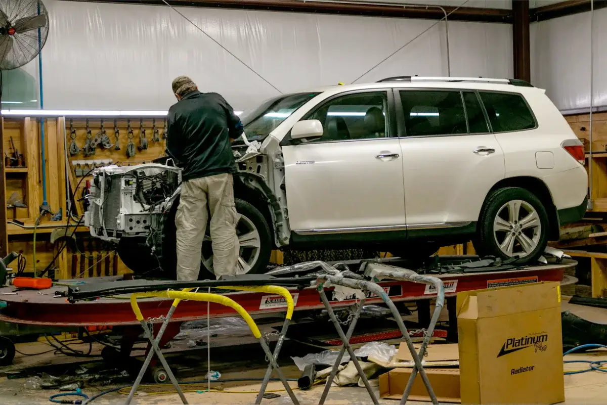 collision center tech on bench